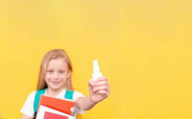 Little girl in  surgical medical mask isolated on blue background. Virus protection concept. Top horizontal view