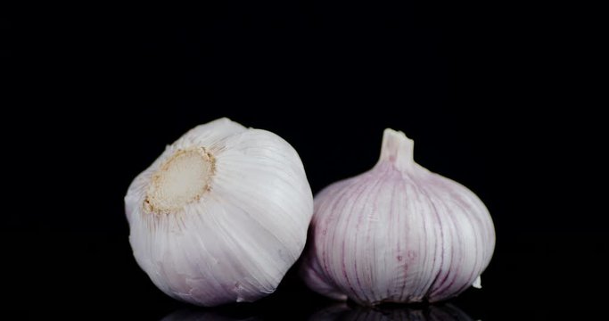Head of fresh garlic slowly rotate.