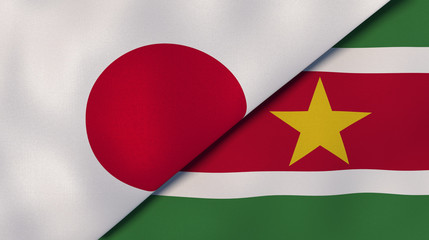 The flags of Japan and Suriname. News, reportage, business background. 3d illustration