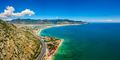 Top view aerial photo from flying drone of a Ca Na town with national road and national railway, Ninh Thuan, Vietnam.