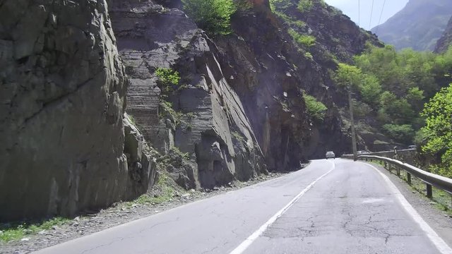 CHALUS, IRAN: Dolly Tracking Pov Front Shot View Of Driving In a mountainous Country Road with traffic