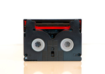 Back side of Mini DV video cassette - tape, isolated on white background. Vintage video recording...