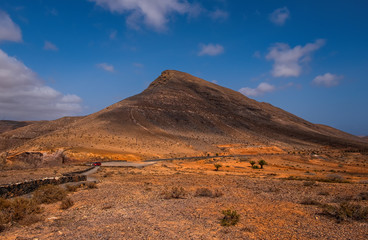 Fototapeta na wymiar Landscape of fields and mountains near Antigua village, Fuerteventura, Canary Islands, Spain