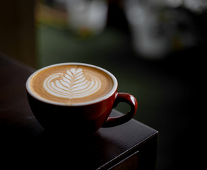 Latte art Coffee on table at cafe
