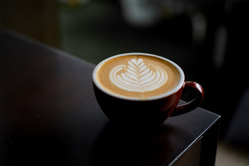 Latte art Coffee on table at cafe