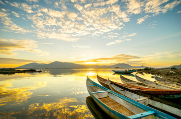 Traditional Boat and location fisherman on the beach at sunrise time, Hon Thien village, Phan Rang, Vietnam