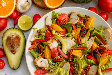 salad with smoked chicken and vegetables on the decorated table