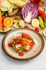 Fish fillet with sesame rice, and vegetables, healthy food on a decorated table