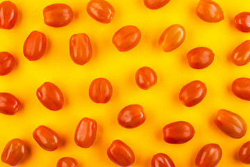 Delicious red tomatoes top view on yellow background