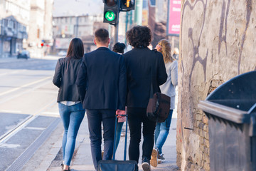 Group of friends (colleagues) hanging out in an urban area.