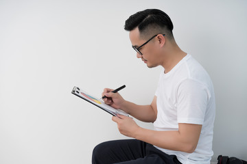 Home office scene of young Asian men