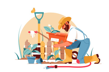 Handsome adult bearded man gardener gardening using equipment.