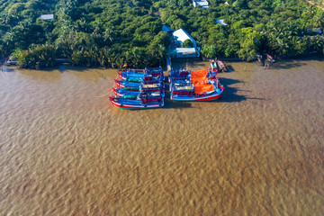 Aerial view of fishing boats anchored in Con Phung or Phung island, Ben Tre, Vietnam. Mekong Delta