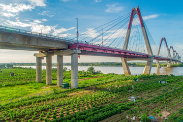 Fototapeta premium Aerial view of Nhat Tan bridge in Ha Noi, Vietnam. Nhat Tan Bridge is a bridge crossing the Red River. Panorama