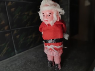 A Santa Clause Toy Standing