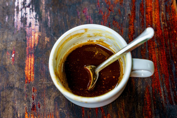 Top view a cup of Giang egg coffee  on wood background. Vietnamese coffee in Ha Noi, Vietnam. Eggs are beaten with coffee, hot drink or with ice