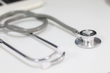 Stethoscope isolated equipment on white texture with blurred background