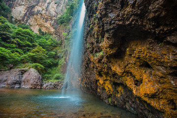 Naklejka na ściany i meble Scenic View Of Waterfall