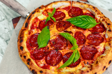 Italian pizza with mozzarella and basil