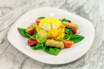 Vegetable pancake with chicken nipples and boiled egg. Breakfast