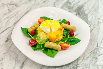 Vegetable pancake with chicken nipples and boiled egg. Breakfast