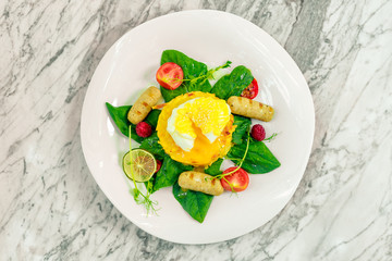 Vegetable pancake with chicken nipples and boiled egg. Breakfast