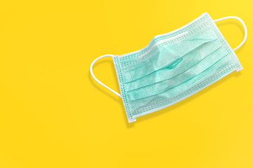 Medical mask for protection against.
on yellow background and clipping path for using.