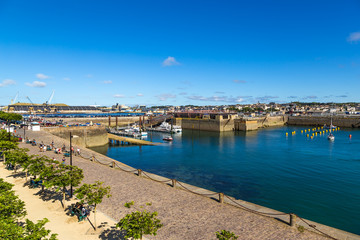 Fototapeta na wymiar Saint-Malo, France. Embankment, old fortifications and port