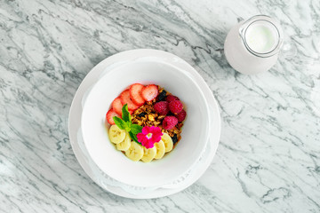 breakfast. Muesli with banana and strawberries and milk. Healthy Food Beautiful Serving