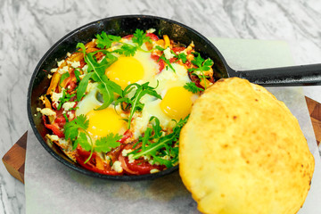 fried eggs with pepper in a pan, a beautiful serving