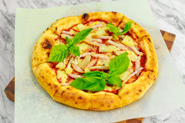Italian pizza with mozzarella and basil