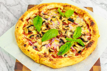 Italian pizza with mozzarella and basil