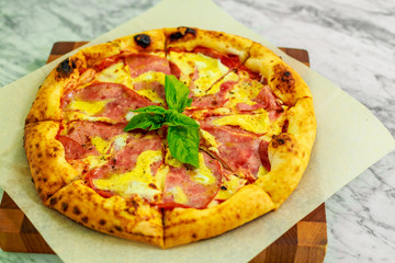 Italian pizza with mozzarella and basil