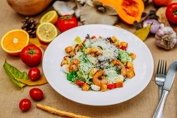 Autumn table setting with pumpkins. Thanksgiving dinner. shrimp caesar salad