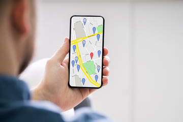 Man Using GPS Map On Mobilephone