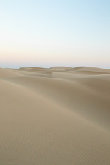 View of sand dunes against sky