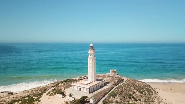 Aerial view of Cape Trafalgar, drone having point of interest the lighthouse,  Cadiz, Spain. Atlantic Ocean, northwest of the Strait of Gibraltar. In 1805 naval Battle of Trafalgar took place here.