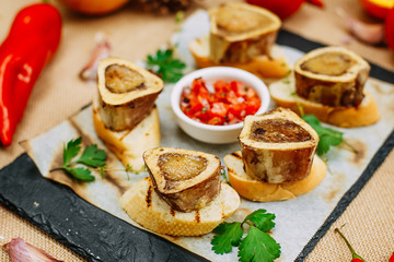 Autumn table setting with pumpkins. Thanksgiving dinner. Sugar marrow with crispy croutons from homemade baguette and sauce