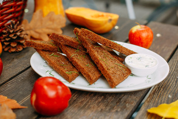 Autumn table setting with pumpkins. Thanksgiving dinner. garlic bread with sauce and herbs