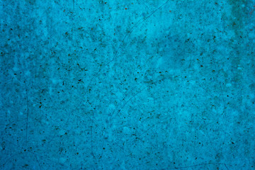 Vintage grunge textured blue wall with fissures