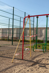 Fototapeta premium Children's Playground in quarantine. The concept of fighting covid-19.