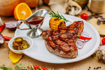 Autumn table setting with pumpkins. Thanksgiving dinner. Steak with Vegetables