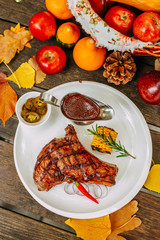 Autumn table setting with pumpkins. Thanksgiving dinner. Steak with Vegetables