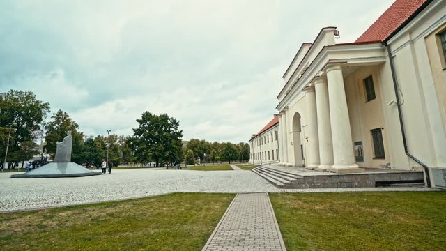 The National Museum of Lithuania, a major tourist destination, with the statue of King Mindaugas on the left-hand side. 
