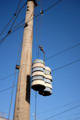 Concrete weighting agents hanging on a railway post.