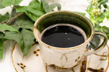 写真素材: 陶器に注がれたホットコーヒー