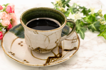 写真素材: 陶器に注がれたホットコーヒー