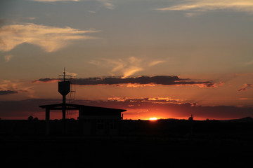 at the sunset a silhouette in the airport