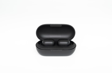 Black true wireless earbuds with power bank case on the white isolated background