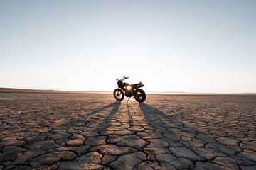 Motorcycle parked in Death Valley during sunset